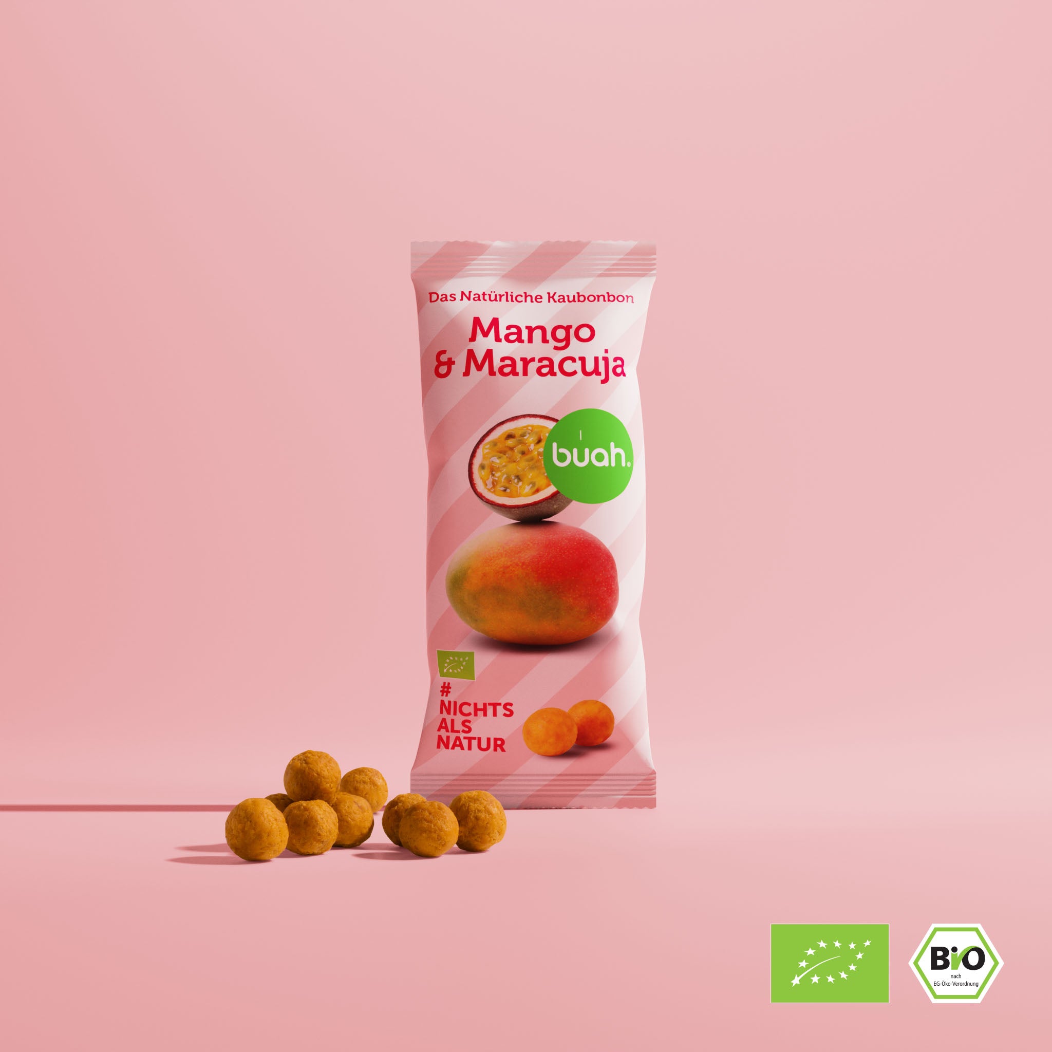 buah Mango-Maracuja Kaunbonbon Verpackung vor pink farbigem Hintergrund